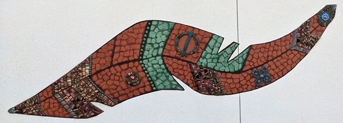 on this feather you can see several symbols including a spiral, the Adinkra symbols for unity and resilience.