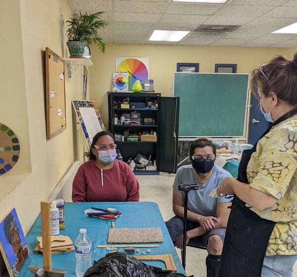 Program Director Dawn Teaching Students how to use tools in Mosaic 