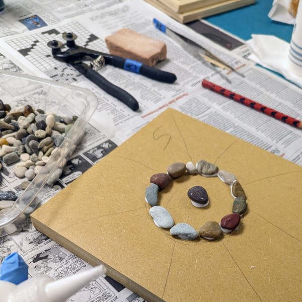 Mosaic being created with stones